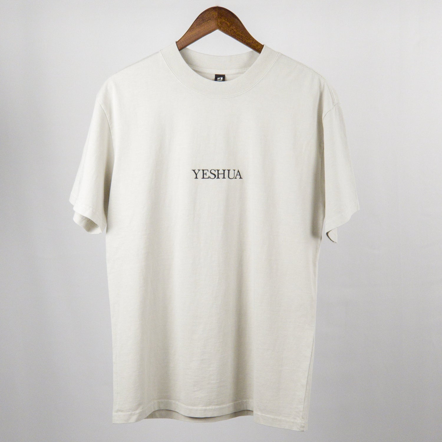 Discover the unique blend of comfort and expression with our embroidered YESHUA oversized faded T-shirt. More than just a garment, it's a canvas for personal style.